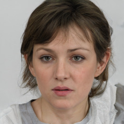 Neutral white young-adult female with medium  brown hair and grey eyes