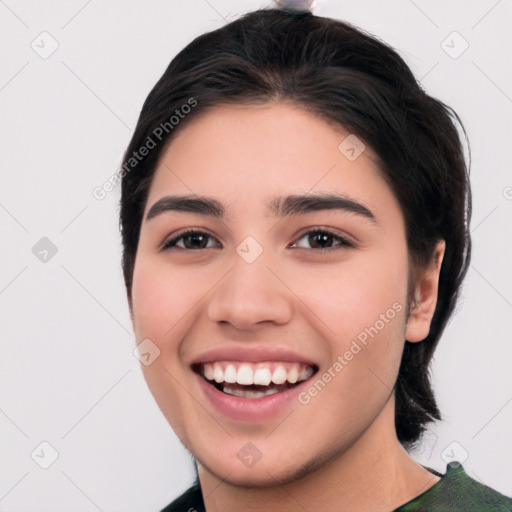 Joyful white young-adult female with medium  black hair and brown eyes