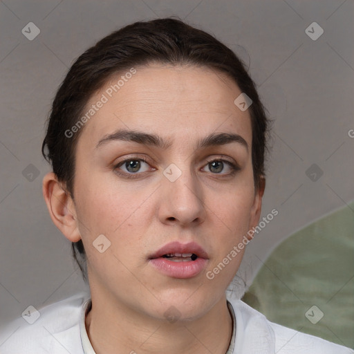 Neutral white young-adult female with short  brown hair and brown eyes