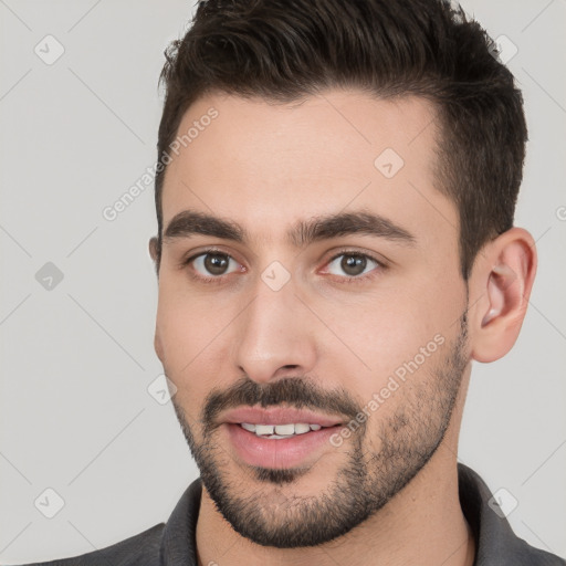 Joyful white young-adult male with short  brown hair and brown eyes