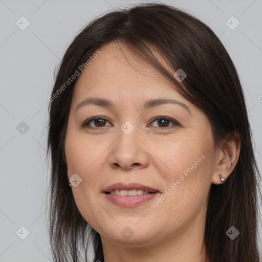 Joyful white adult female with long  brown hair and brown eyes