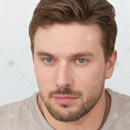 Neutral white young-adult male with short  brown hair and grey eyes