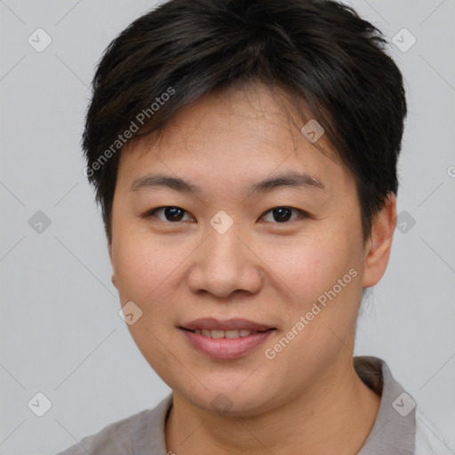 Joyful asian young-adult female with short  brown hair and brown eyes