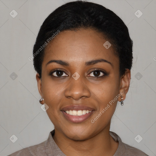 Joyful black young-adult female with short  black hair and brown eyes