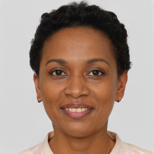 Joyful latino adult female with short  black hair and brown eyes
