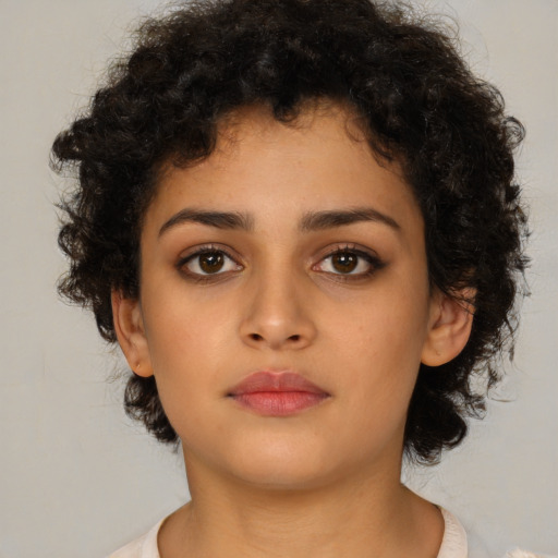 Neutral latino young-adult female with short  brown hair and brown eyes