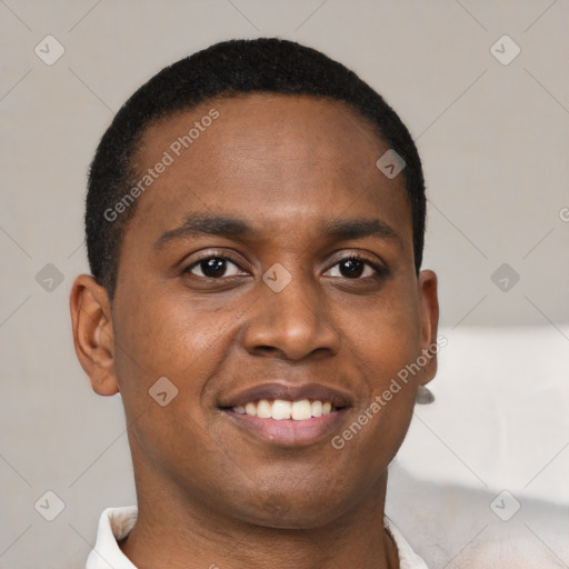 Joyful black young-adult male with short  brown hair and brown eyes