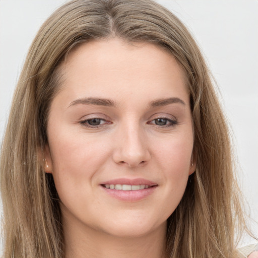 Joyful white young-adult female with long  brown hair and grey eyes