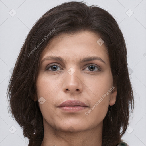 Neutral white young-adult female with long  brown hair and brown eyes