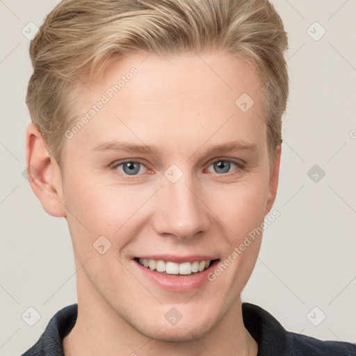 Joyful white young-adult female with short  brown hair and blue eyes