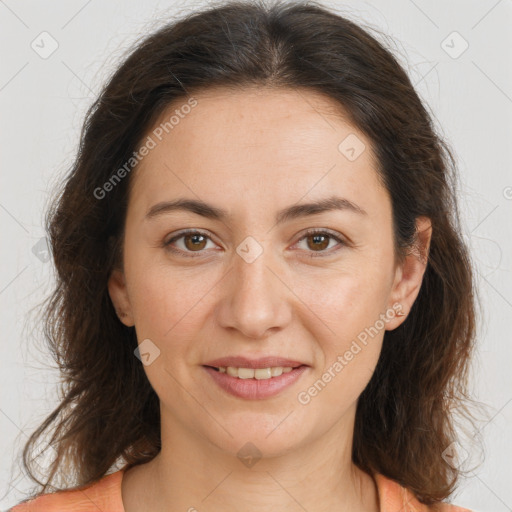 Joyful white adult female with long  brown hair and brown eyes