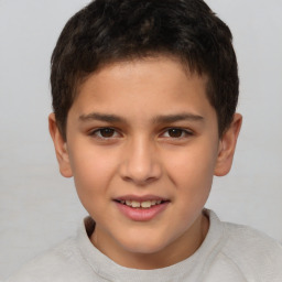 Joyful white child male with short  brown hair and brown eyes