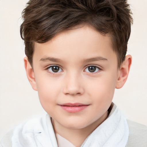 Joyful white child male with short  brown hair and brown eyes