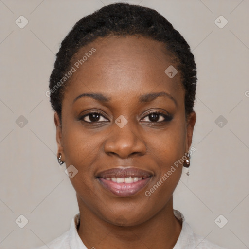 Joyful black young-adult female with short  black hair and brown eyes