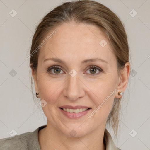 Joyful white adult female with medium  brown hair and grey eyes