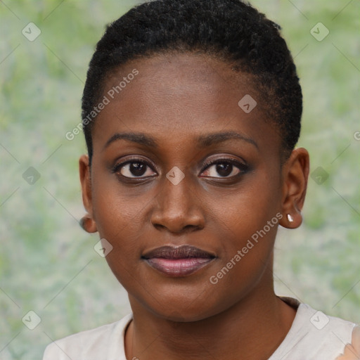 Joyful black young-adult female with short  black hair and brown eyes