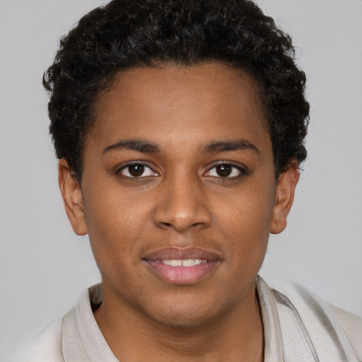 Joyful black young-adult female with short  brown hair and brown eyes
