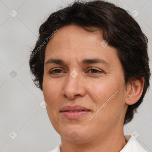 Joyful white adult female with medium  brown hair and brown eyes