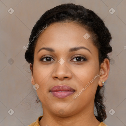 Joyful black young-adult female with long  brown hair and brown eyes