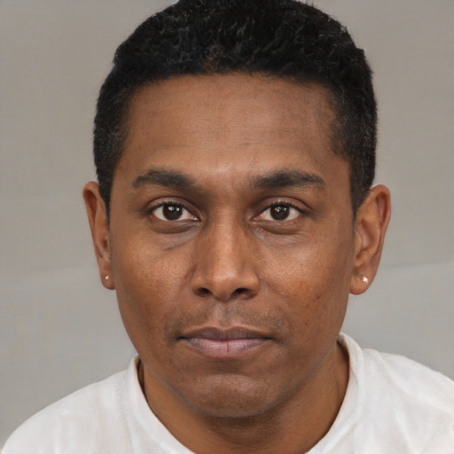 Neutral black young-adult male with short  black hair and brown eyes