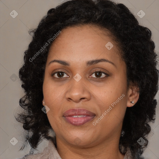 Joyful black adult female with medium  brown hair and brown eyes