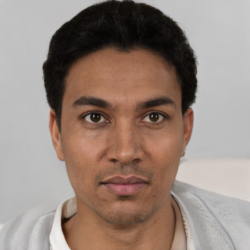Neutral white young-adult male with short  black hair and brown eyes