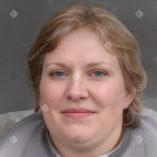 Joyful white adult female with medium  brown hair and blue eyes