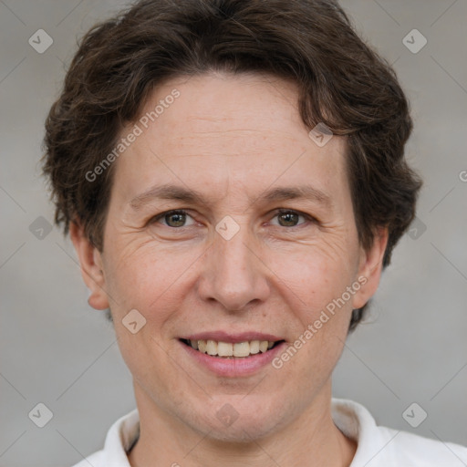 Joyful white adult female with short  brown hair and brown eyes