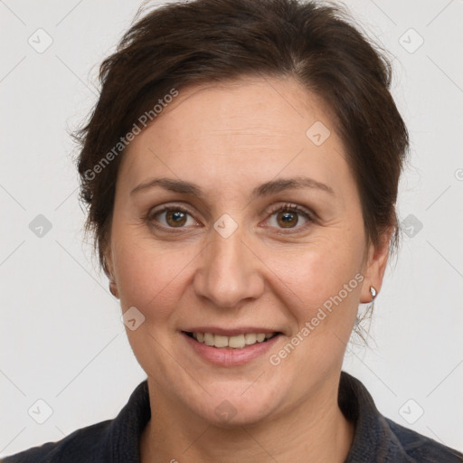 Joyful white adult female with short  brown hair and brown eyes