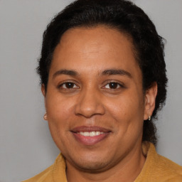 Joyful white adult female with short  brown hair and brown eyes