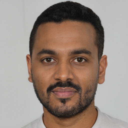 Neutral black young-adult male with short  black hair and brown eyes
