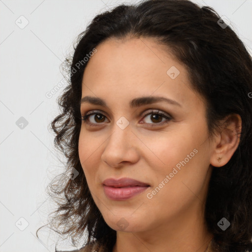 Joyful latino young-adult female with long  brown hair and brown eyes