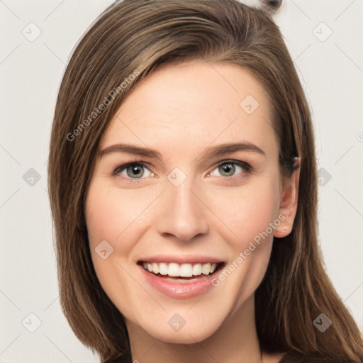 Joyful white young-adult female with long  brown hair and green eyes