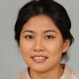 Joyful asian young-adult female with medium  brown hair and brown eyes