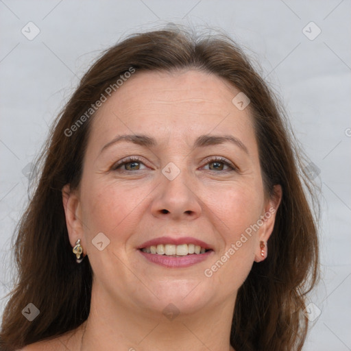 Joyful white adult female with medium  brown hair and grey eyes