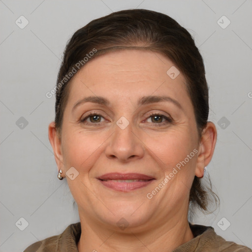 Joyful white adult female with medium  brown hair and brown eyes