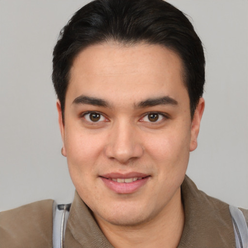Joyful white young-adult male with short  black hair and brown eyes