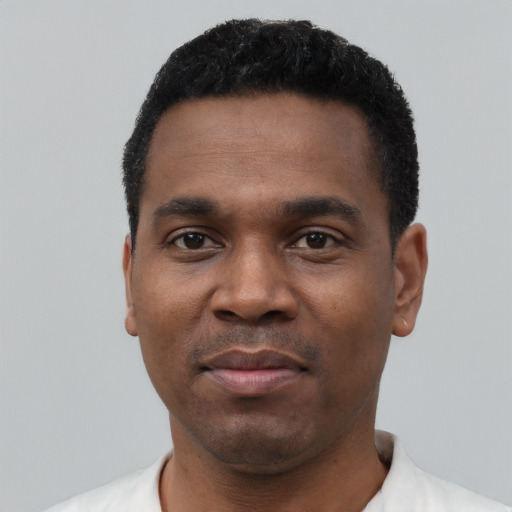 Neutral black young-adult male with short  black hair and brown eyes