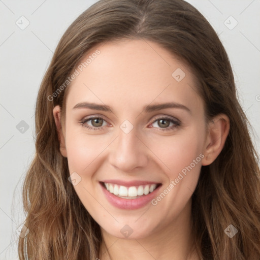 Joyful white young-adult female with long  brown hair and green eyes