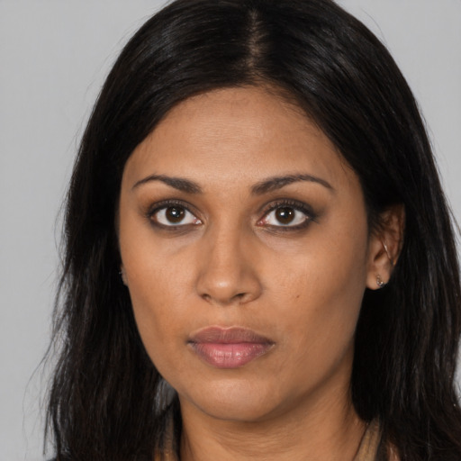 Neutral black young-adult female with long  black hair and brown eyes