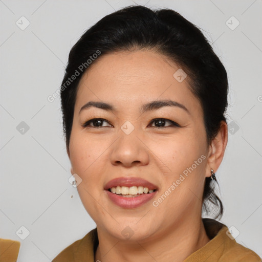 Joyful asian young-adult female with medium  black hair and brown eyes