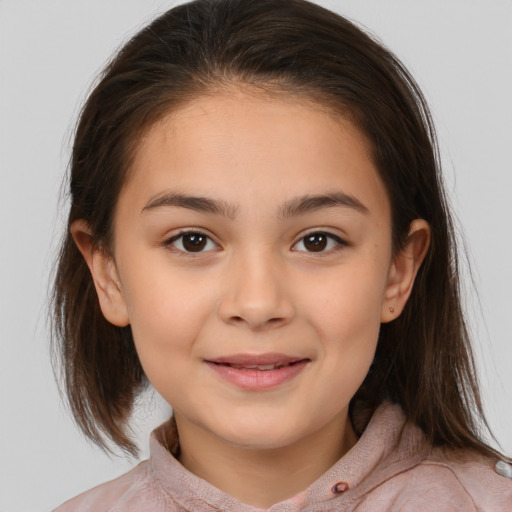 Joyful white child female with medium  brown hair and brown eyes