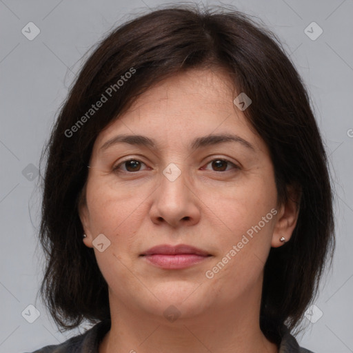 Joyful white adult female with medium  brown hair and brown eyes