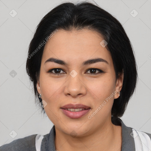 Joyful asian young-adult female with medium  black hair and brown eyes