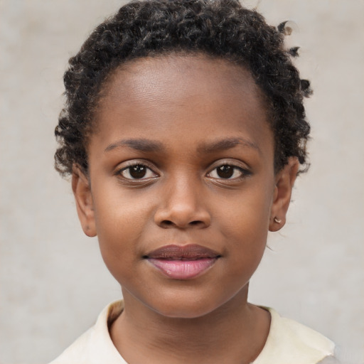 Joyful black child female with short  brown hair and brown eyes