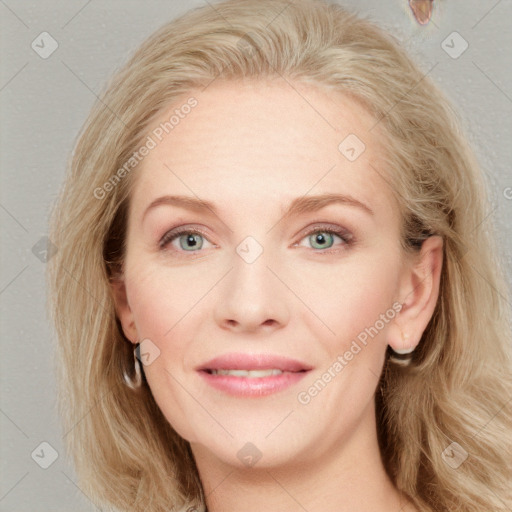 Joyful white young-adult female with long  brown hair and blue eyes