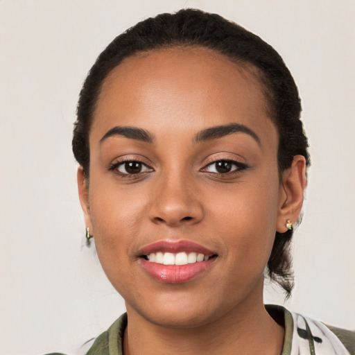 Joyful white young-adult female with medium  black hair and brown eyes