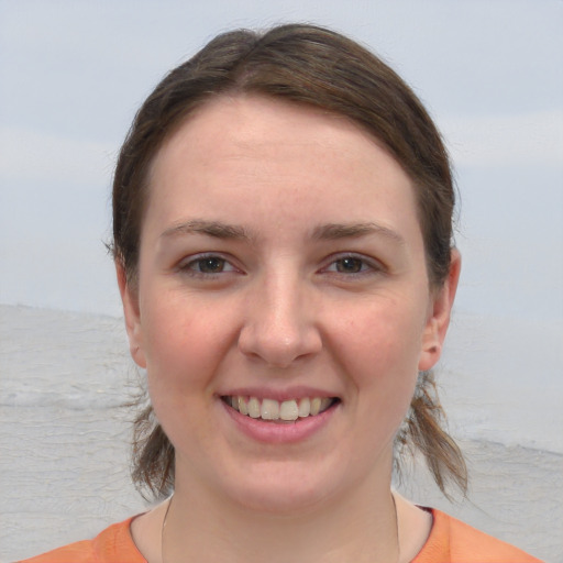 Joyful white young-adult female with medium  brown hair and brown eyes