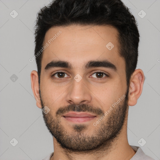 Joyful white young-adult male with short  black hair and brown eyes