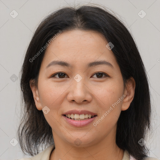 Joyful asian young-adult female with medium  brown hair and brown eyes